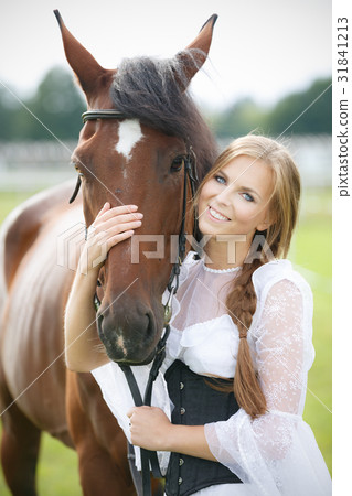 Beautiful woman with chestnut horse Beautiful woman with chestnut horse 31841213