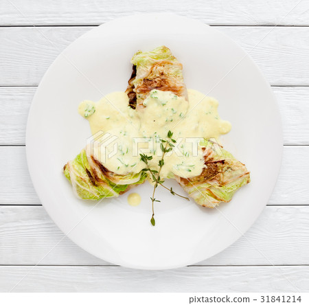 Cabbage rolls with sour cream sauce top view Cabbage rolls with sour cream sauce top view 31841214