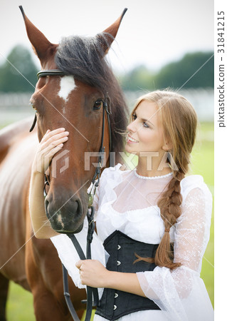 Beautiful woman with chestnut horse Beautiful woman with chestnut horse 31841215