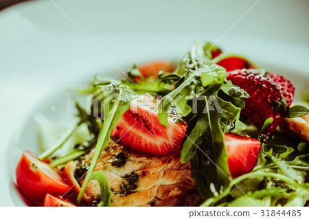 salad with salmon on white plate. Lifestyle salad with salmon on white plate. Lifestyle 31844485