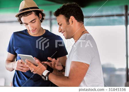 Smart young men sharing business ideas 31845336