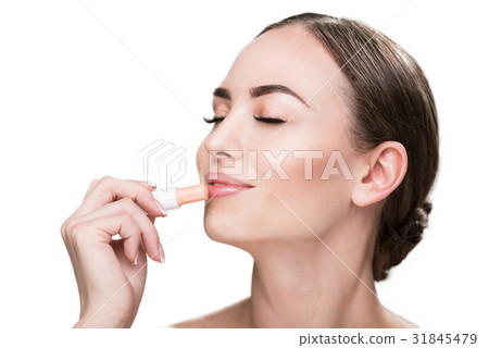 Happy beautiful girl applying make-up 31845479