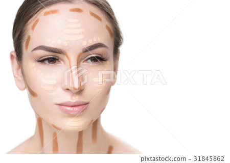 Attentive young lady using concealers Attentive young lady using concealers 31845862