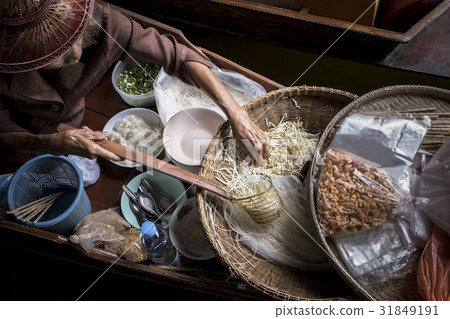 woman making thai noodle food in floating market woman making thai noodle food in floating market 31849191
