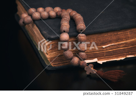 Old book and church rosary 31849287