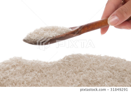 Rice in a spoon on a white background 31849291