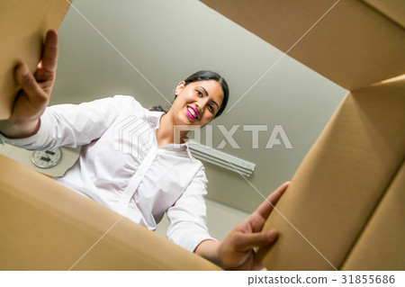 A woman looking in the box A woman looking in the box 31855686