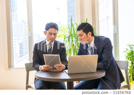 Business meeting Core working meeting Participate Committed male employee two people handsome Business meeting Core working meeting Participate Committed male employee two people handsome 31856768
