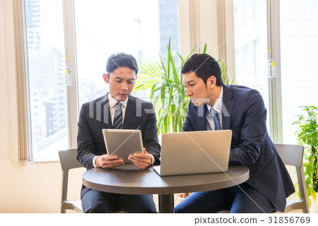 Business meeting Core working meeting Participate Committed male employee two people handsome Business meeting Core working meeting Participate Committed male employee two people handsome 31856769