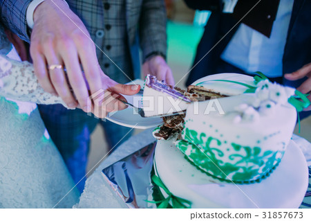 The close-up view of the newlyweds` hands taking 31857673