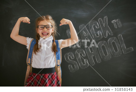 Kid is learning in class 31858143