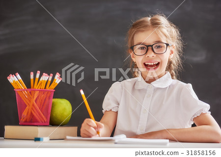 Kid is learning in class 31858156