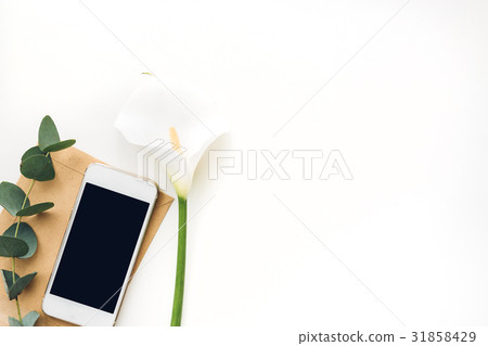 Mobile phone with blank screen and flowers on 31858429