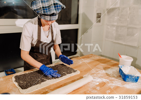 Rolling roulade. Making Poppy Seed Snail Rolling roulade. Making Poppy Seed Snail 31859153