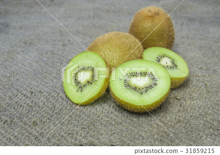 Ripe whole kiwi fruit and half kiwi fruit isolated Ripe whole kiwi fruit and half kiwi fruit isolated 31859215