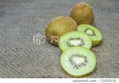 Ripe whole kiwi fruit and half kiwi fruit isolated Ripe whole kiwi fruit and half kiwi fruit isolated 31859216