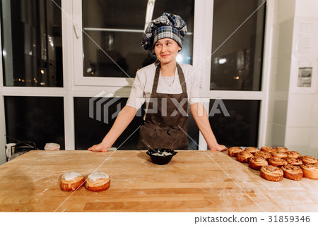 Woman bake pies. Confectioners make desserts Woman bake pies. Confectioners make desserts 31859346