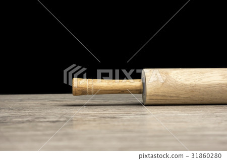 Rolling pin on table 31860280