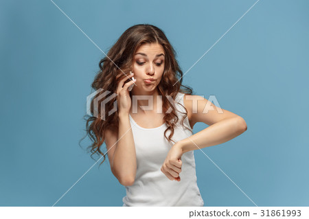 The portrait of disgusted woman with mobile phone The portrait of disgusted woman with mobile phone 31861993