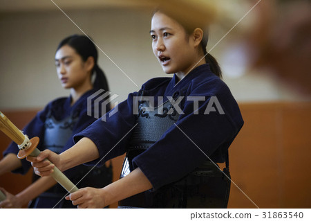 A girl driving into kendo 31863540