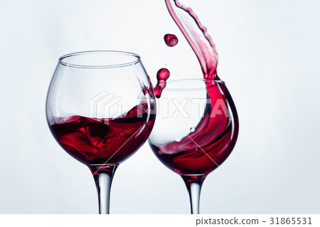 Two wine glasses in toasting gesture with big 31865531