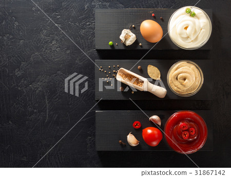 tomato sauce, mayonnaise and mustard in bowl tomato sauce, mayonnaise and mustard in bowl 31867142