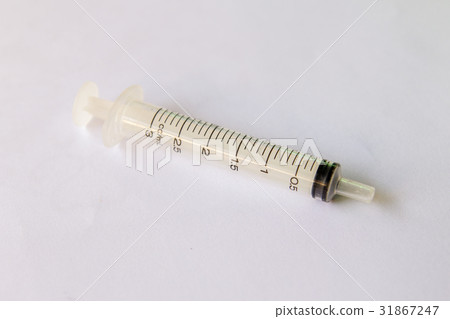 Transparent plastic syringe on white background Transparent plastic syringe on white background 31867247