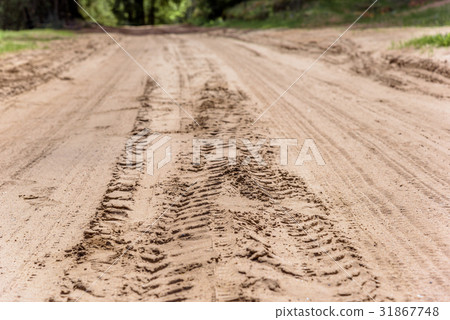 Tread marks on dry rural sandy road Tread marks on dry rural sandy road 31867748