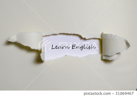 The word learn english appearing behind torn paper 31869467
