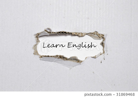 The word learn english appearing behind torn paper 31869468