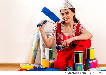 Repair home woman holding paint roller for 31869753