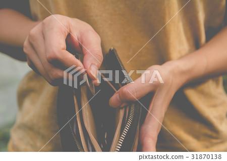 Close-up woman standing and holding money coin Close-up woman standing and holding money coin 31870138