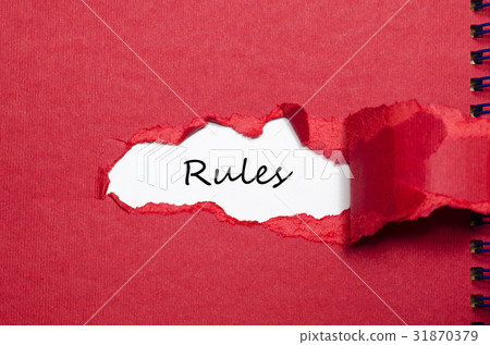 The word rules appearing behind torn paper The word rules appearing behind torn paper 31870379