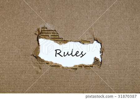 The word rules appearing behind torn paper The word rules appearing behind torn paper 31870387
