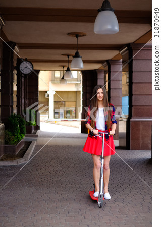 woman travelling by scooter 31870949