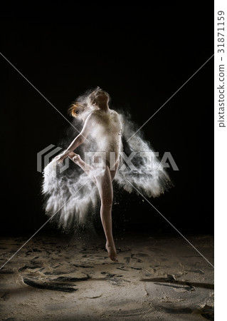 Sexy slim girl in white dust cloud studio portrait Sexy slim girl in white dust cloud studio portrait 31871159