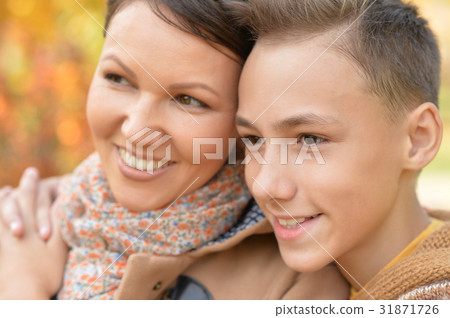 Mother with son in autumn park Mother with son in autumn park 31871726