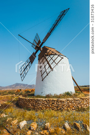 Traditional white stony windmill at Fuertaventura 31873416