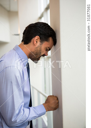 Stressed businessman at conference centre Stressed businessman at conference centre 31877081