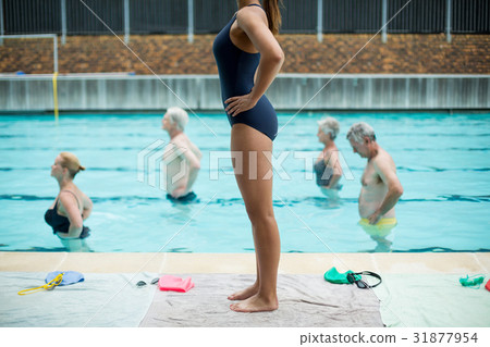 Swimmers following female trainer Swimmers following female trainer 31877954