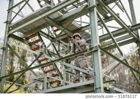 Military soldier guarding with a rifle 31878117