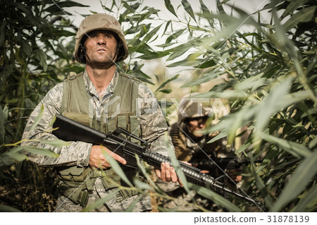 Military soldiers during training exercise with weapon Military soldiers during training exercise with weapon 31878139