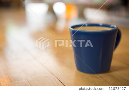 Coffee cup on wooden table in cafeteria Coffee cup on wooden table in cafeteria 31878427