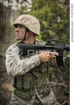 Military soldier during training exercise with weapon 31878465