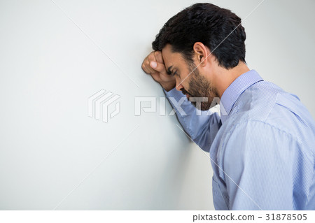 Stressed businessman at conference centre Stressed businessman at conference centre 31878505
