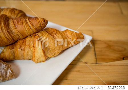 Croissant served in plate at coffee house 31879013