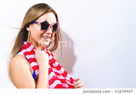 Young woman with USA national holiday accessories 31879487