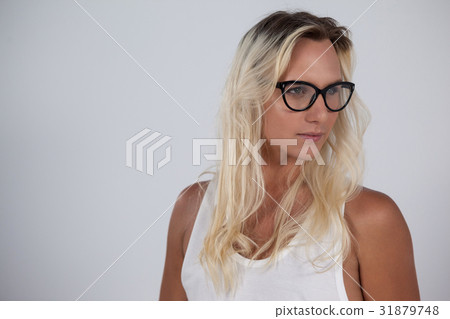 Transgender woman looking away against gray background 31879748