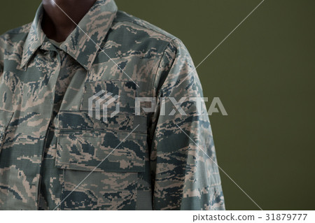 Androgynous man in camouflage uniform Androgynous man in camouflage uniform 31879777