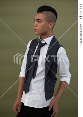 Transgender standing against green background 31880141